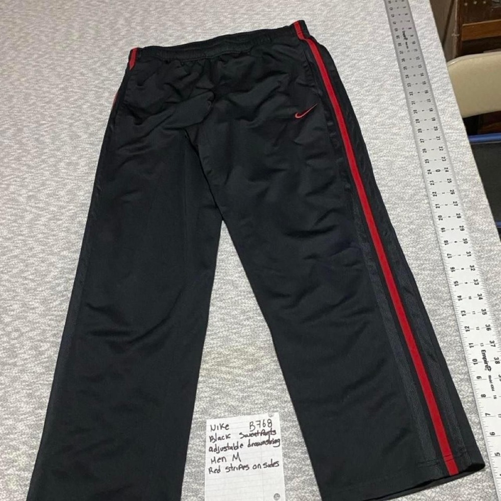 Nike black sweatpants with red stripes on sides drawstring size M. SKU-B768